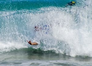 Body Surfer at Sandy Beach enjoys a goodride